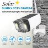 Justop - Caméra de vidéosurveillance factice, alimentée par panneau solaire, avec projecteurs de sécurité LED et détecteur de mo